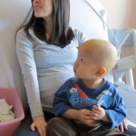 Jeremy holds out his central line for the nurse.